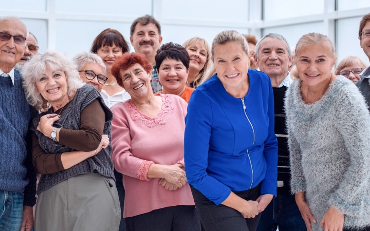 Portrait Of Senior Friends Hiking In Countryside