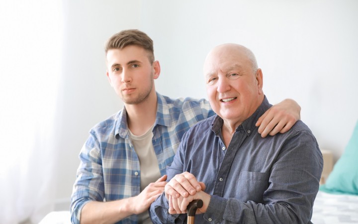 Caregiver with senior man in nursing home